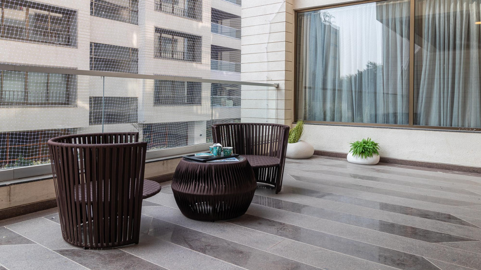 This is an example of a contemporary balcony in Ahmedabad.