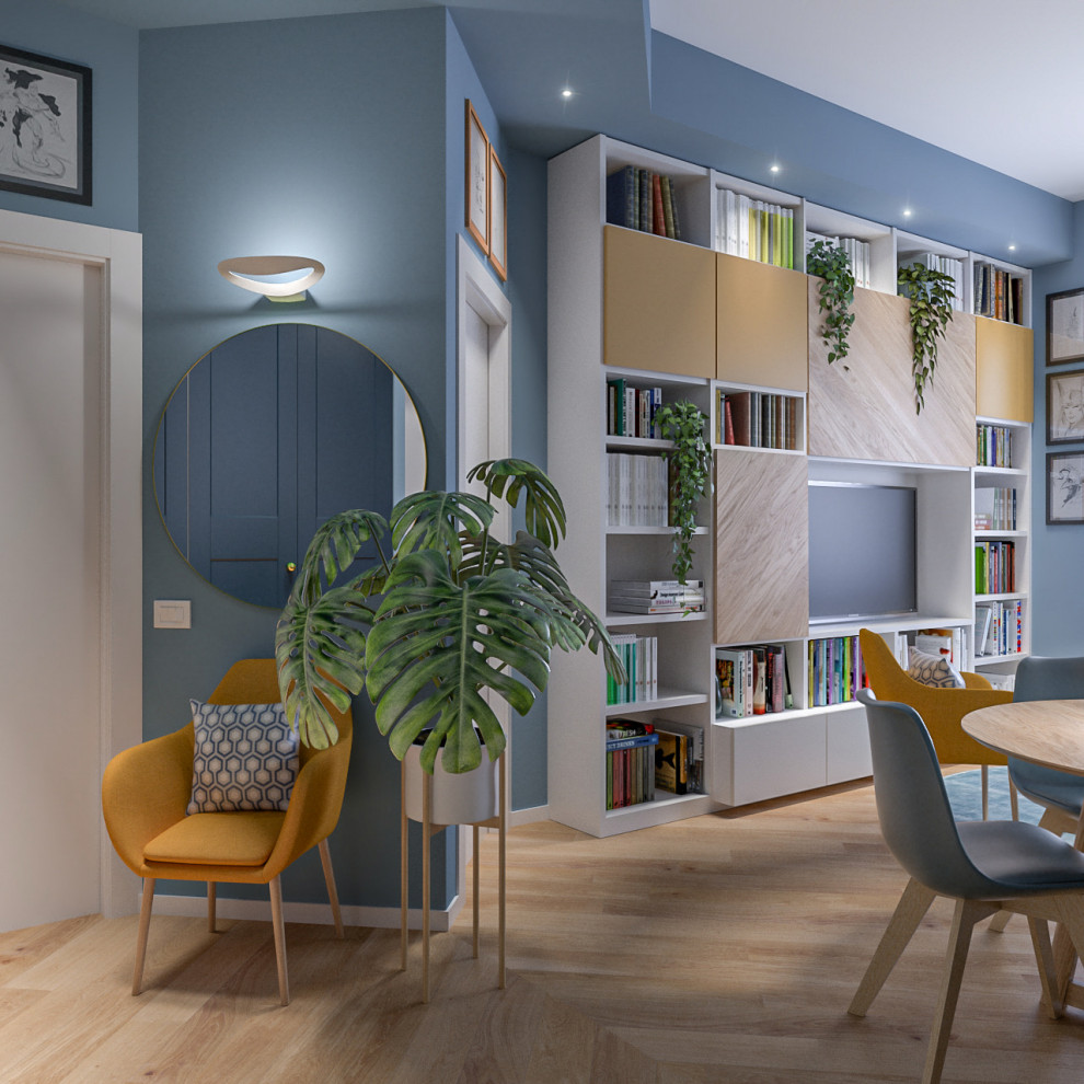 Photo of a mid-sized contemporary open concept living room in Milan with a library, blue walls, light hardwood floors, a concealed tv and recessed.