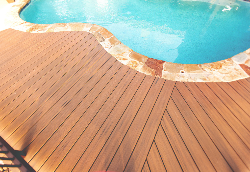 Inspiration for a small backyard ground level mixed material railing deck remodel