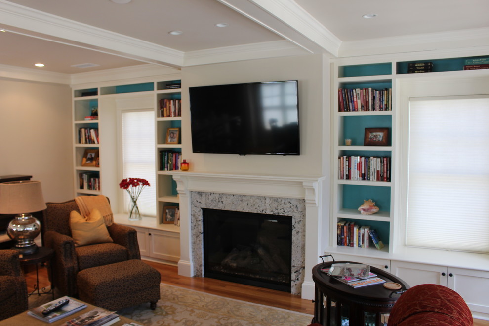 This is an example of a traditional family room in Boston.