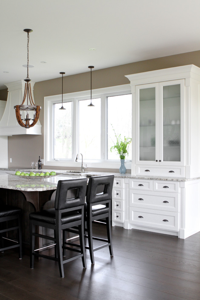 Open concept kitchen - mid-sized transitional l-shaped light wood floor open concept kitchen idea in Toronto with a double-bowl sink, shaker cabinets, white cabinets, granite countertops, an island and stainless steel appliances