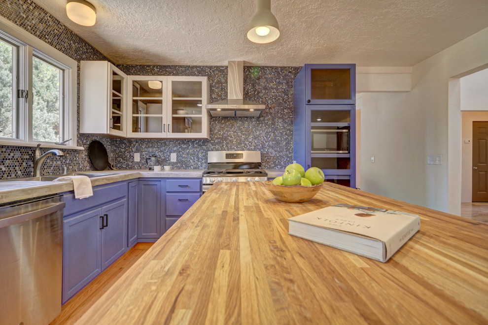 Inspiration for a mid-sized u-shaped kitchen in Other with a double-bowl sink, concrete benchtops, multi-coloured splashback, stainless steel appliances, with island, brown floor, grey benchtop, shaker cabinets, purple cabinets, mosaic tile splashback and medium hardwood floors.
