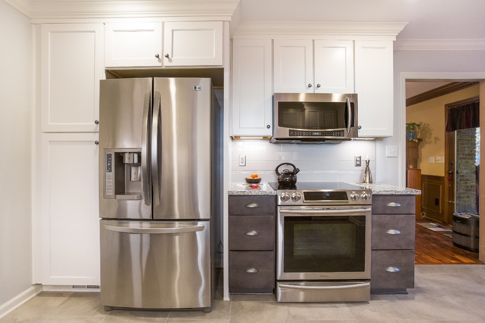 Mid-sized transitional u-shaped porcelain tile enclosed kitchen photo in Birmingham with a double-bowl sink, shaker cabinets, granite countertops, gray backsplash, ceramic backsplash, stainless steel appliances and no island