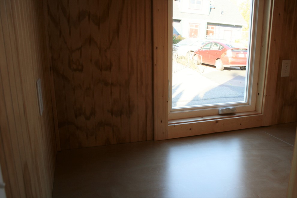 Example of a small mountain style guest dark wood floor bedroom design in Seattle with brown walls and no fireplace