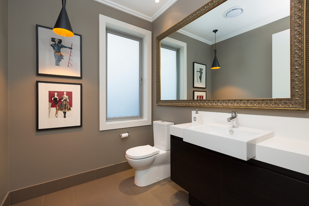 This is an example of a contemporary bathroom in Sydney with flat-panel cabinets.