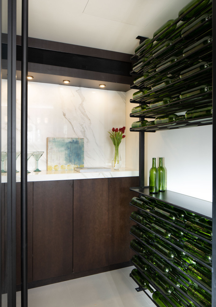 Inspiration for a small midcentury wine cellar in Orlando with storage racks.