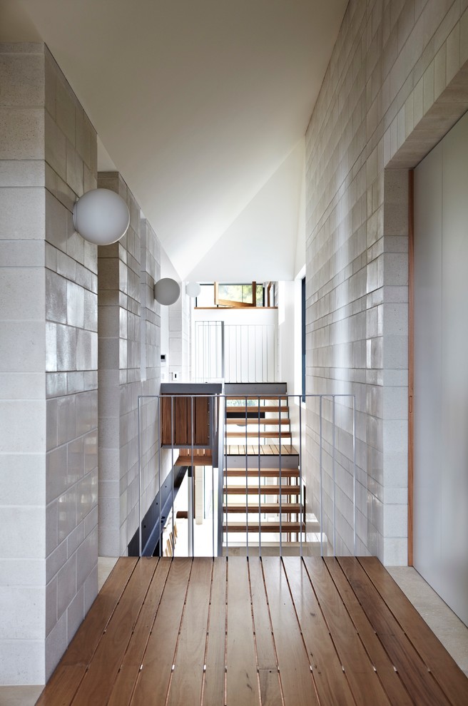 Design ideas for a mid-sized contemporary hallway in Brisbane with white walls and marble floors.