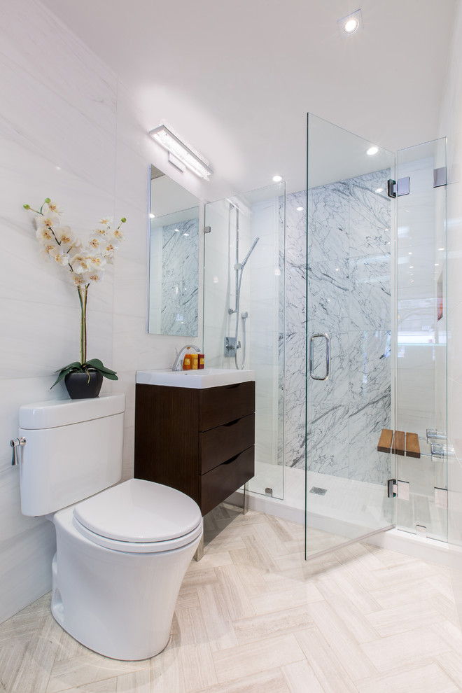 Inspiration for a mid-sized contemporary 3/4 bathroom in New York with flat-panel cabinets, dark wood cabinets, an alcove shower, a two-piece toilet, a console sink, gray tile, white tile, glass tile and white walls.