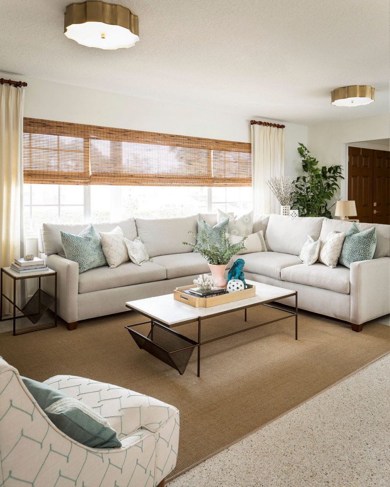 Design ideas for a mid-sized transitional enclosed living room in Orlando with white walls, a wall-mounted tv and beige floor.
