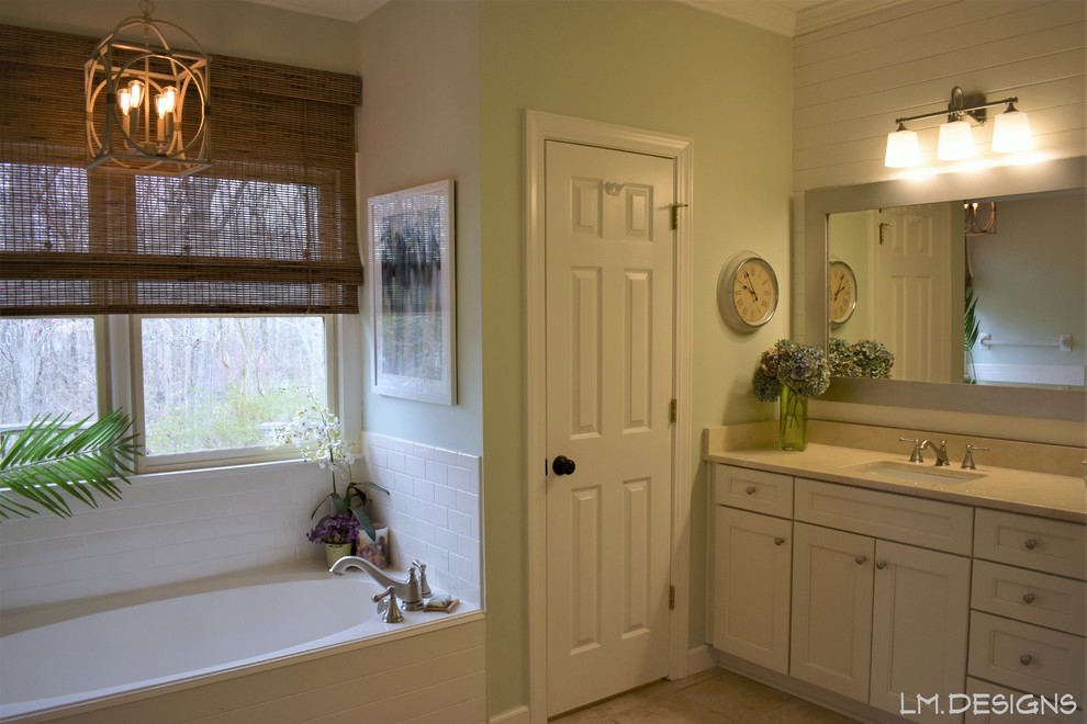 Alcove bathtub - mid-sized transitional master white tile and subway tile ceramic tile and beige floor alcove bathtub idea with recessed-panel cabinets, white cabinets, green walls, an undermount sink, marble countertops, a hinged shower door and beige countertops