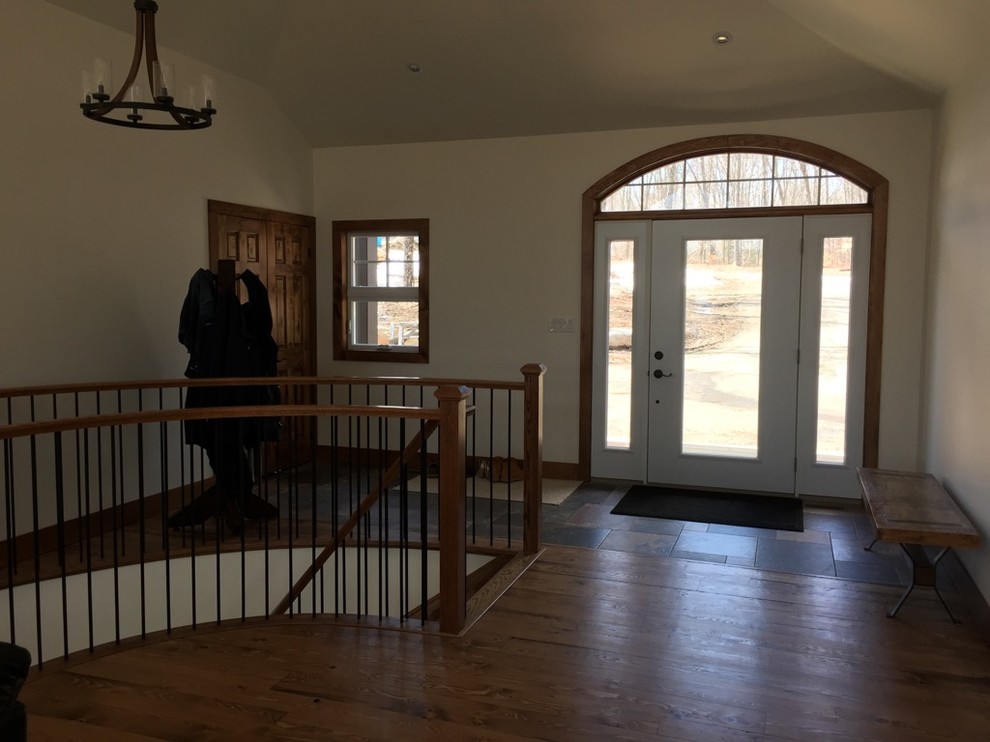 Single front door - single front door idea in Toronto with white walls and a white front door
