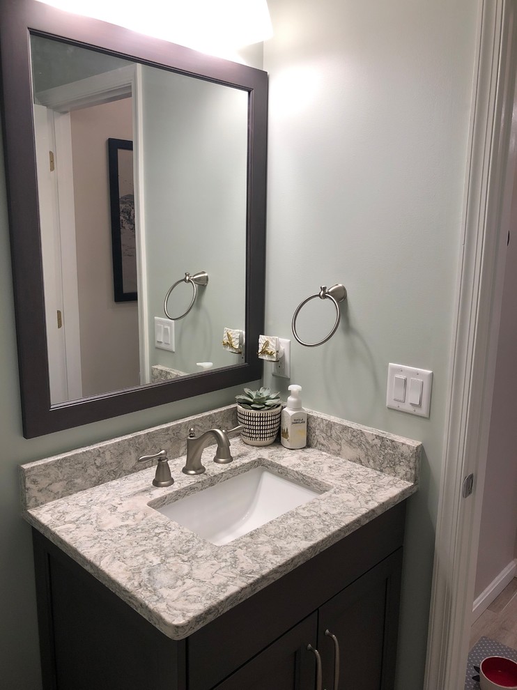 Design ideas for a small transitional bathroom in Baltimore with shaker cabinets, grey cabinets, a one-piece toilet, black tile, porcelain floors, an undermount sink, engineered quartz benchtops, grey floor and multi-coloured benchtops.