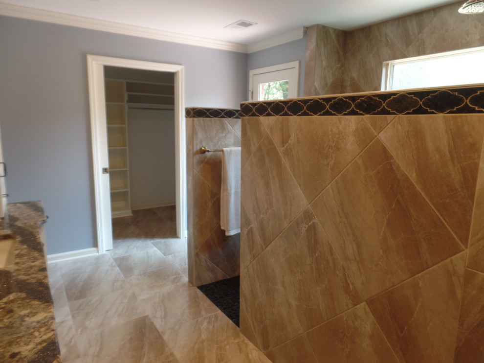 Home design - large transitional master beige tile and porcelain tile porcelain tile and beige floor home design idea with shaker cabinets, white cabinets, a two-piece toilet, blue walls, an undermount sink and quartz countertops