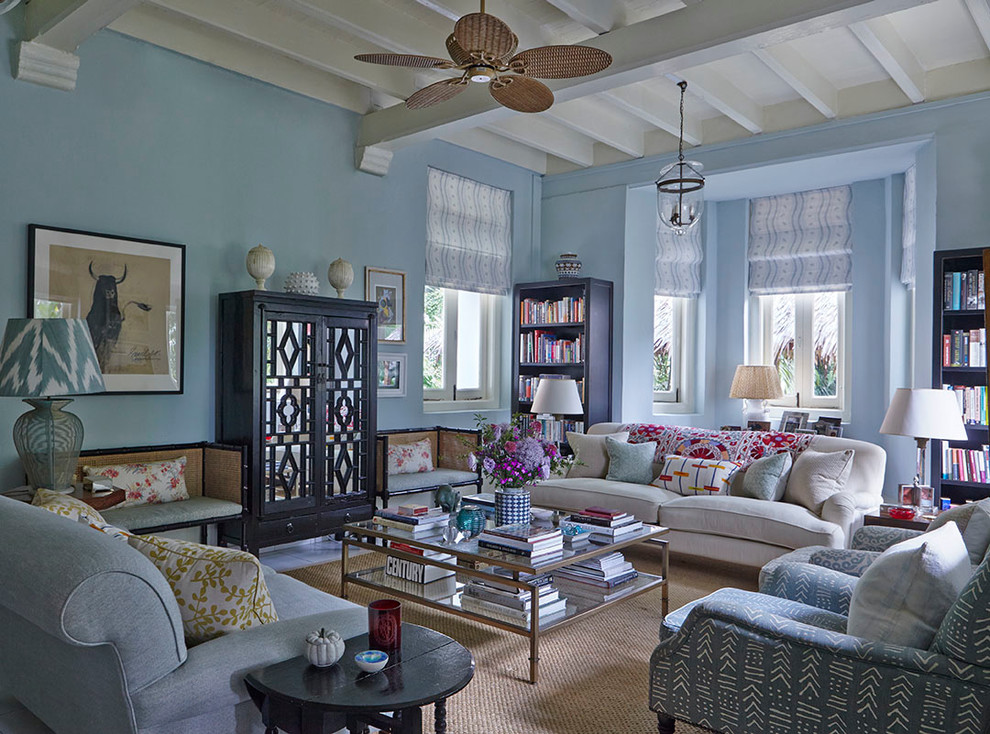 Design ideas for a fusion living room in Singapore With Blue Walls and No TV.