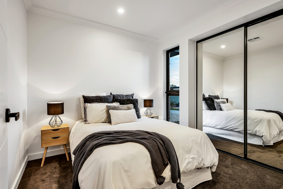 Kleines Industrial Gästezimmer ohne Kamin mit weißer Wandfarbe, Teppichboden und grauem Boden in Adelaide