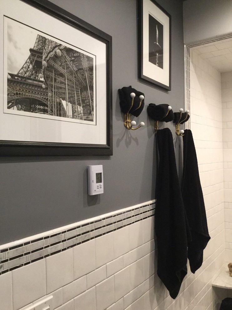 Photo of a mid-sized industrial 3/4 bathroom in Boston with open cabinets, dark wood cabinets, an alcove shower, a one-piece toilet, white tile, porcelain tile, grey walls, mosaic tile floors, a vessel sink, glass benchtops, grey floor and a hinged shower door.