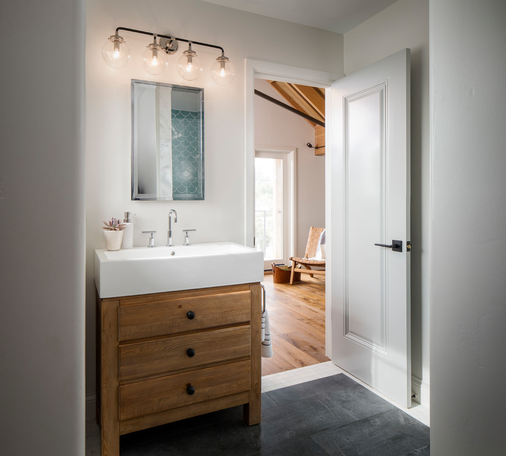 Mid-sized transitional 3/4 bathroom in San Francisco with ceramic tile, white walls, porcelain floors, engineered quartz benchtops, grey floor, medium wood cabinets, a console sink and flat-panel cabinets.
