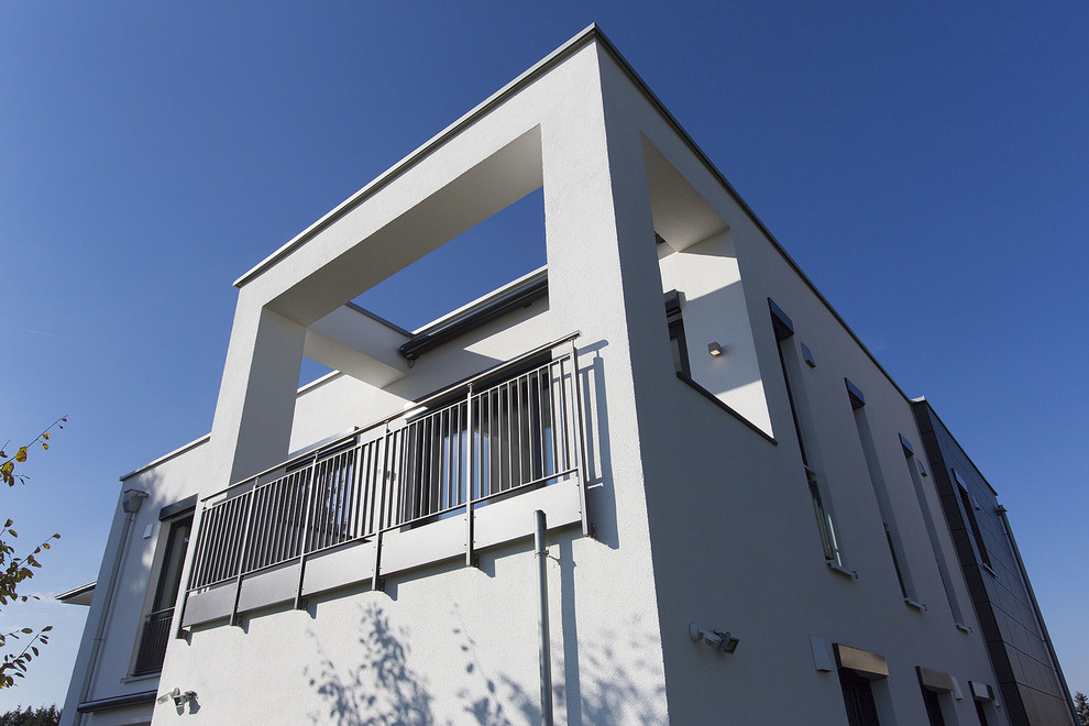 Mid-sized contemporary balcony in Other with an awning.