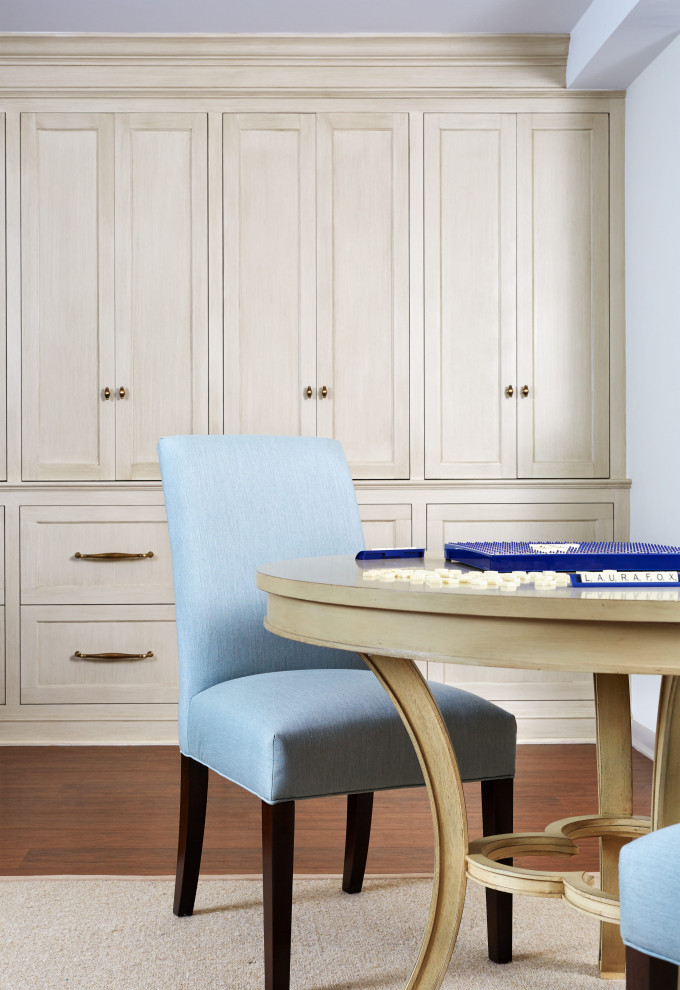 #mcleanrenovation - Rec Room Game Table and Built-Ins - Bright and cheerful basement rec room with beige sectional, game table, built-in storage, and aqua and red accents.

Photo by Stacy Zarin Goldberg Photography
