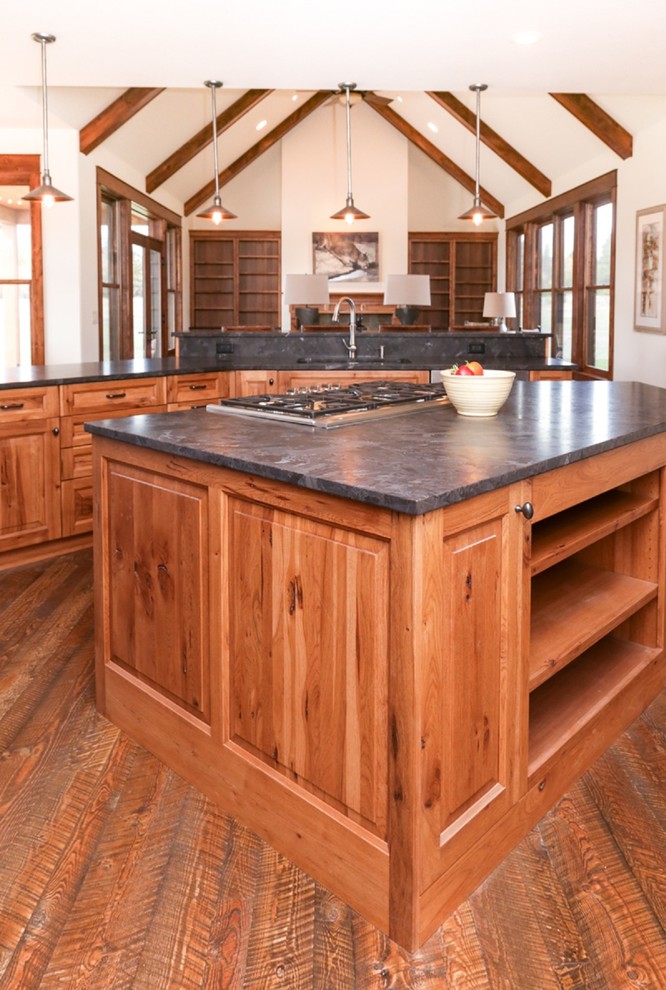 Mid-sized mountain style l-shaped dark wood floor and brown floor open concept kitchen photo with raised-panel cabinets, two islands, an undermount sink, medium tone wood cabinets and gray countertops