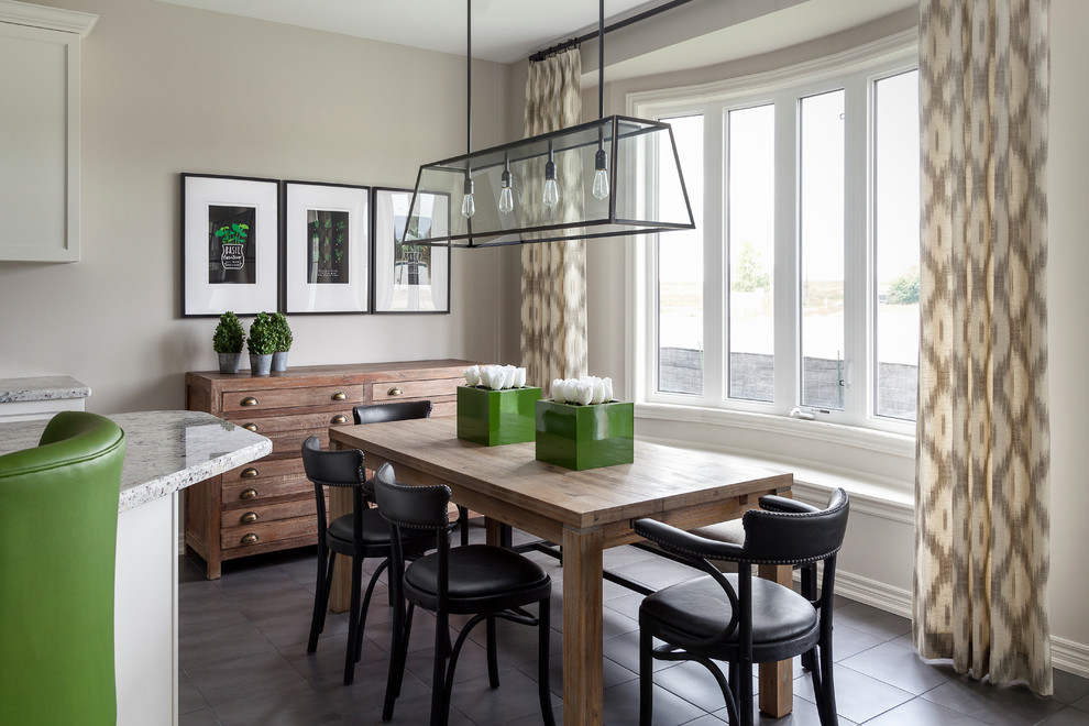 This is an example of a transitional kitchen/dining combo in Toronto with grey walls.