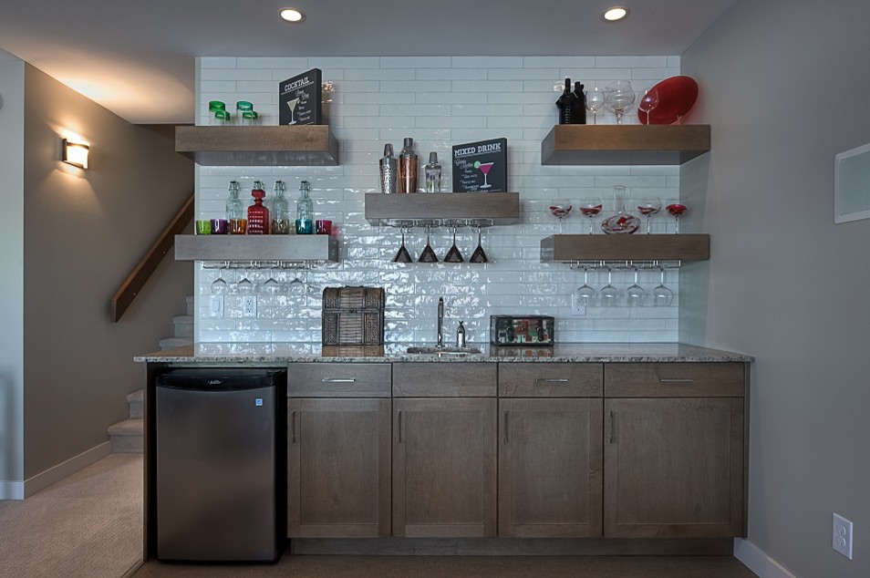 Large transitional home bar in Other.