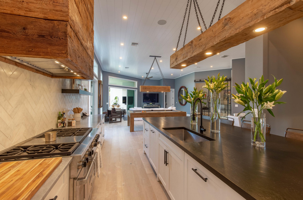 Photo of a mid-sized contemporary galley eat-in kitchen in Miami with an undermount sink, shaker cabinets, white cabinets, marble benchtops, grey splashback, marble splashback, stainless steel appliances, light hardwood floors, with island, yellow floor, grey benchtop and timber.
