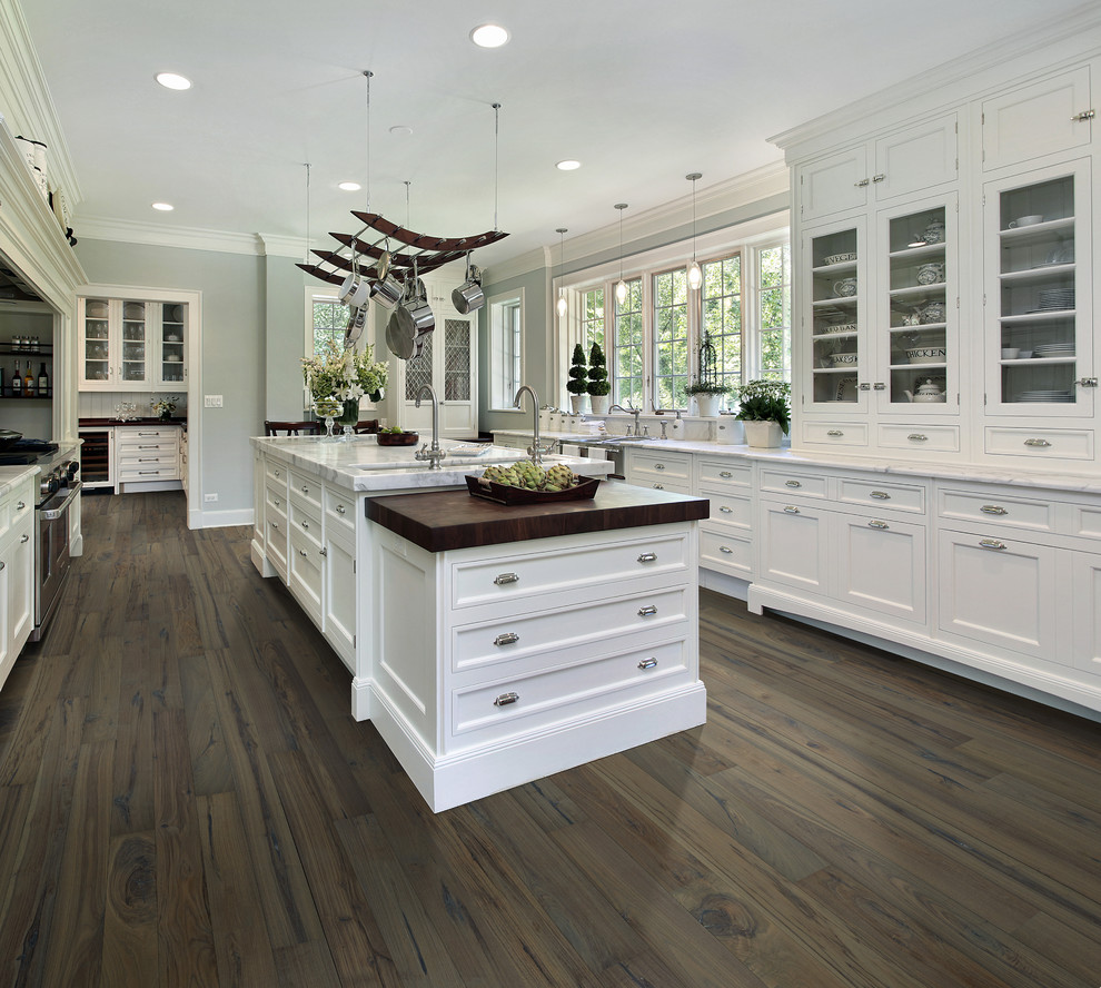 Photo of a large traditional galley eat-in kitchen in Jacksonville with medium hardwood floors and with island.