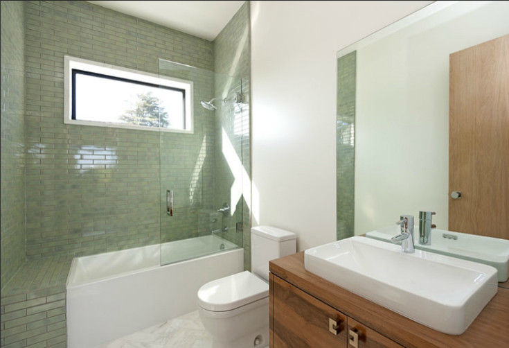 Design ideas for a contemporary master bathroom in Los Angeles with green tile, glass tile and marble floors.