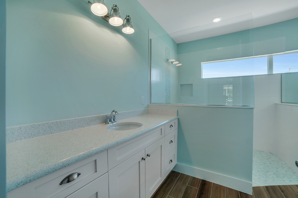 Bathroom - large transitional master multicolored tile bathroom idea with white cabinets, quartzite countertops and recessed-panel cabinets