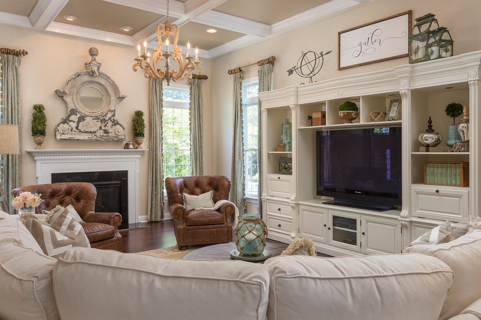 Inspiration for a traditional enclosed family room in DC Metro with beige walls, dark hardwood floors, a standard fireplace, a metal fireplace surround, a freestanding tv and brown floor.