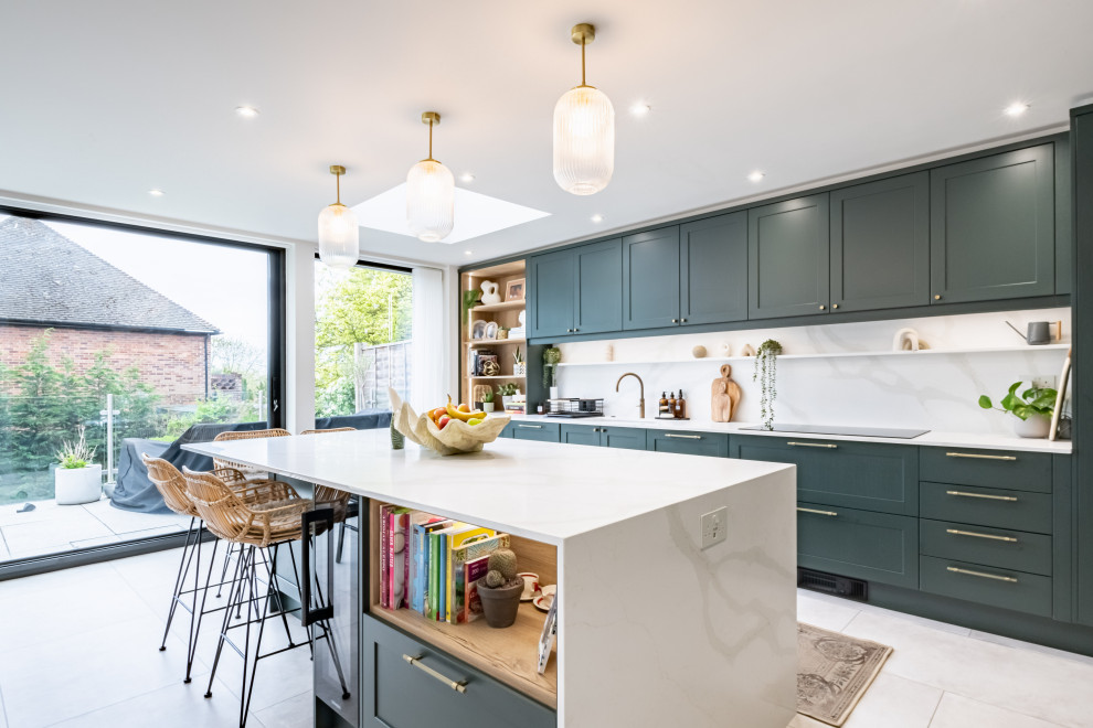 Inspiration for a timeless kitchen remodel in London with shaker cabinets, green cabinets, quartzite countertops, an island and green countertops