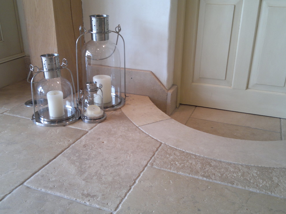Large country kitchen in West Midlands with limestone floors.