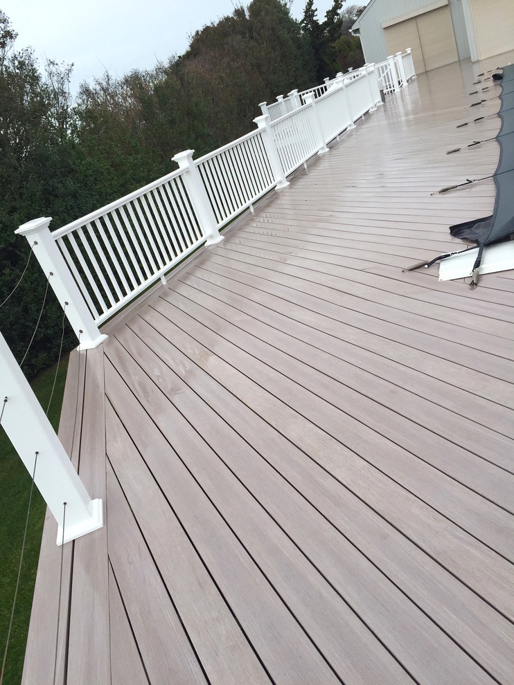Inspiration for a large transitional backyard deck remodel in New York with no cover