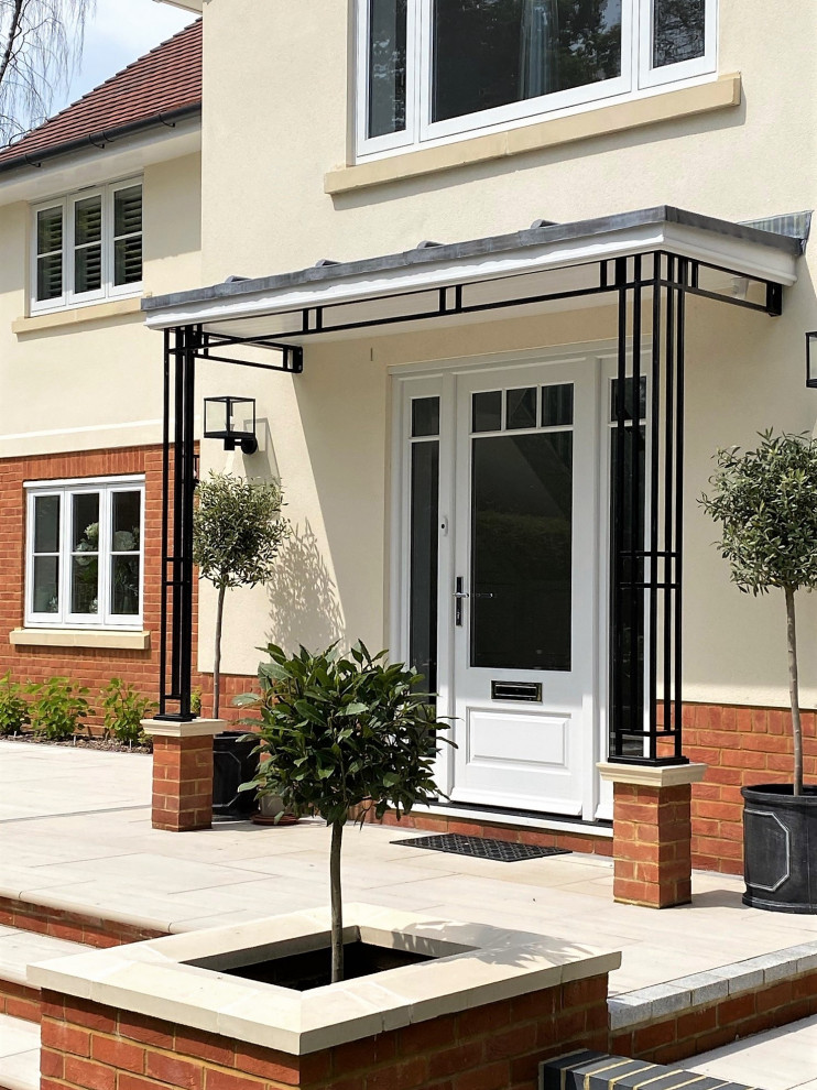 Photo of a medium sized modern porch in Berkshire with a single front door and a white front door.