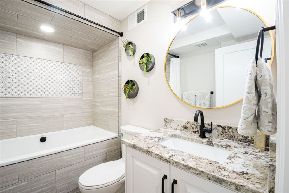 Inspiration for a mid-sized modern kids bathroom in Salt Lake City with raised-panel cabinets, white cabinets, a hot tub, a shower/bathtub combo, a two-piece toilet, gray tile, ceramic tile, grey walls, medium hardwood floors, an undermount sink, granite benchtops, brown floor, a shower curtain and blue benchtops.