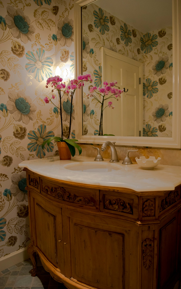 Photo of a mid-sized traditional powder room in Other.