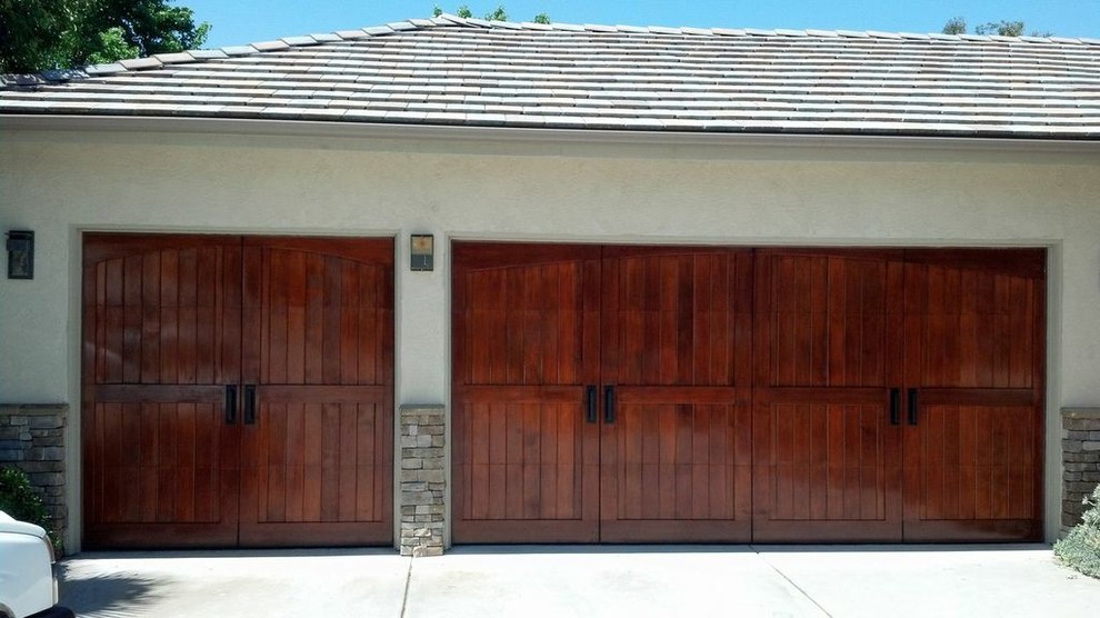 Design ideas for a mid-sized traditional attached two-car garage in San Diego.