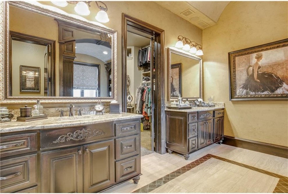 Photo of a large traditional master bathroom in Dallas with raised-panel cabinets, brown cabinets, a two-piece toilet, beige walls, ceramic floors, a drop-in sink, laminate benchtops, beige floor and beige benchtops.