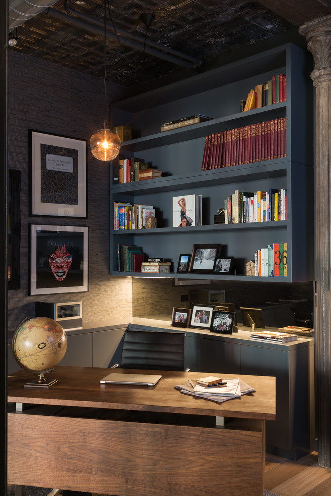 Mid-sized industrial study room in New York with grey walls, light hardwood floors, no fireplace and a freestanding desk.