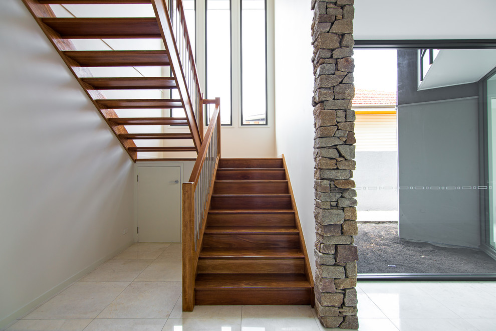 Photo of a contemporary wood staircase in Brisbane.