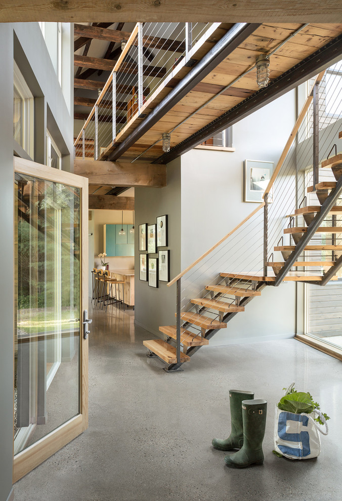 Inspiration for a country wood l-shaped staircase in Portland Maine with metal risers and wood railing.