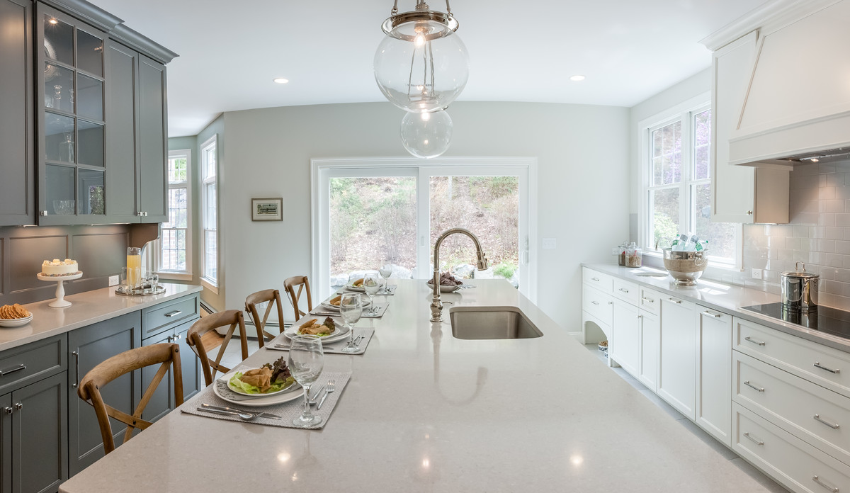 Kitchen - transitional kitchen idea in Boston with an undermount sink, gray cabinets, quartzite countertops, subway tile backsplash, stainless steel appliances and an island