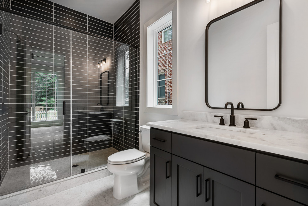 Design ideas for a transitional bathroom in Atlanta with shaker cabinets, grey cabinets, an alcove shower, black tile, white walls, an undermount sink, white floor, a hinged shower door, white benchtops, a single vanity and a built-in vanity.