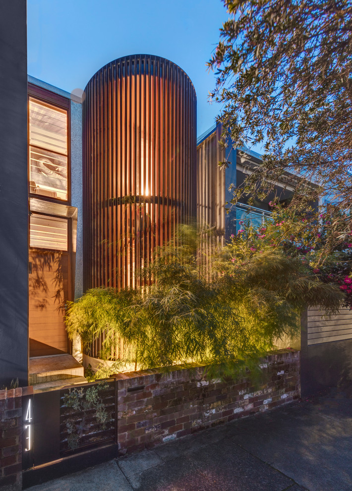 This is an example of a mid-sized contemporary two-storey townhouse exterior in Sydney.