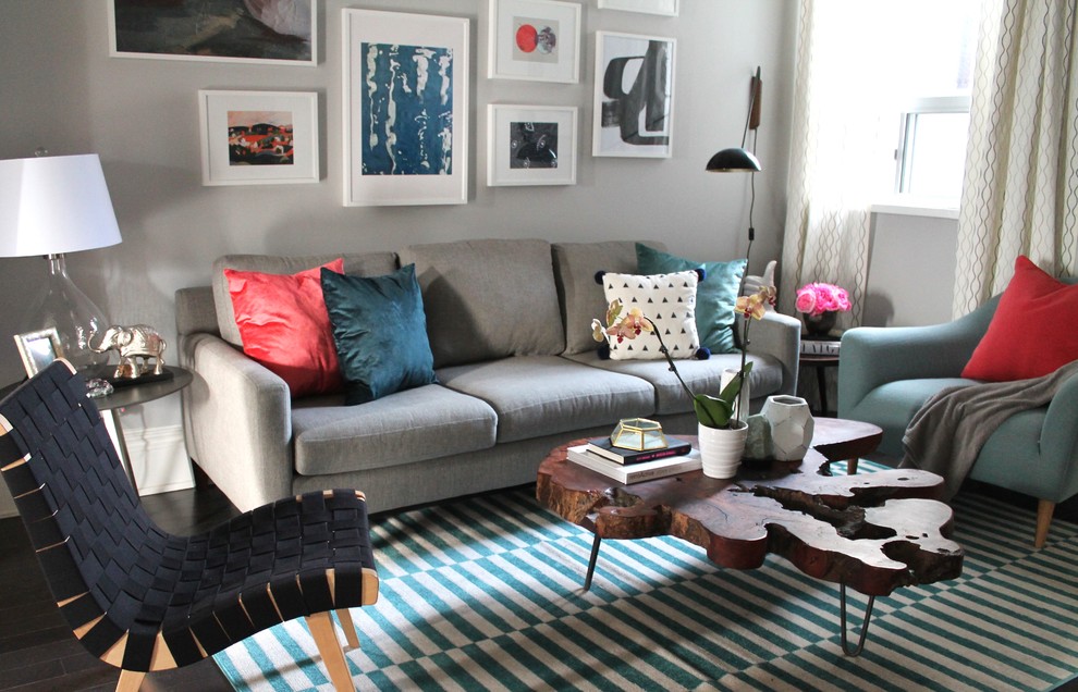 Inspiration for an eclectic living room in Toronto with grey walls and dark hardwood floors.