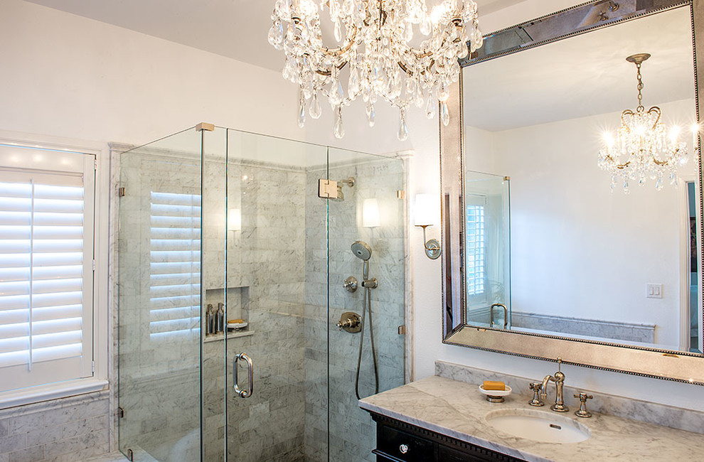 Design ideas for a mid-sized contemporary 3/4 bathroom in San Francisco with raised-panel cabinets, dark wood cabinets, a drop-in tub, an alcove shower, gray tile, marble, white walls, marble floors, an undermount sink, marble benchtops, grey floor and a hinged shower door.