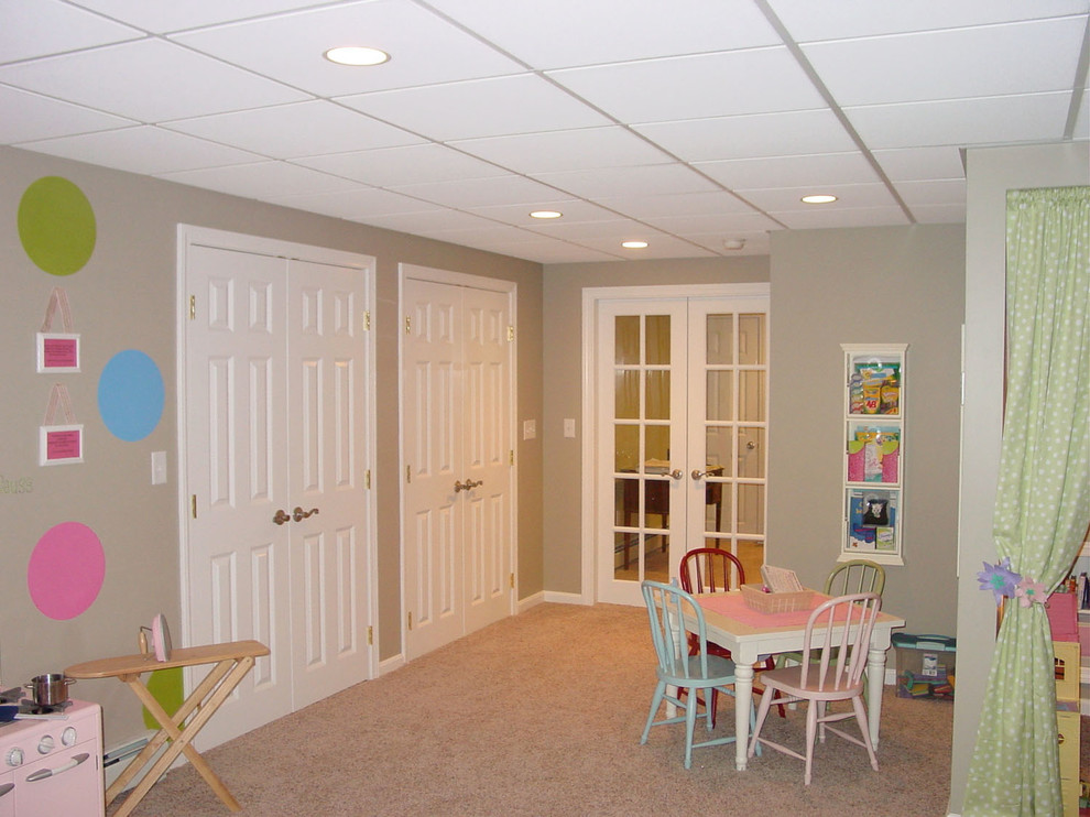 Basement - small transitional underground carpeted basement idea in Boston with beige walls