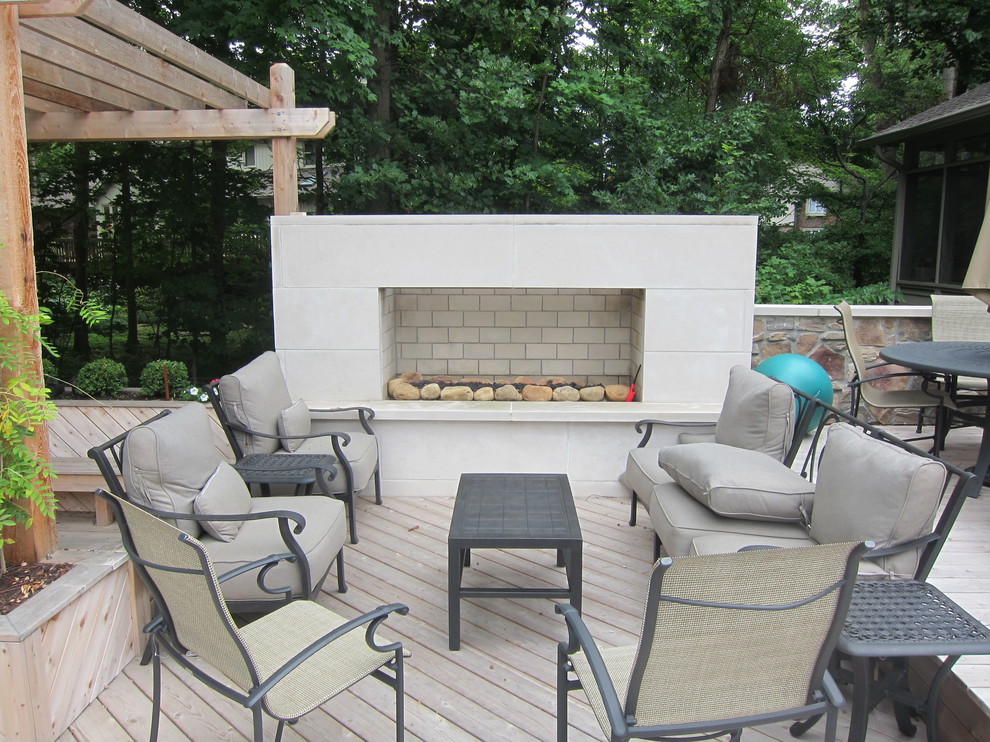 Design ideas for a mid-sized contemporary backyard deck in Indianapolis with a fire feature.