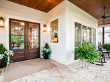 Farmhouse Patio by Noble Classic Homes